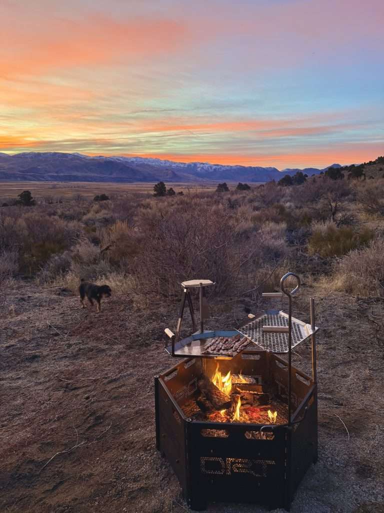 Sunrise-Over-Mountains-while-camping-and-cooking-breakfast-over-the-campfire